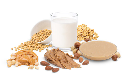 whole nut butter paste with glass of milk