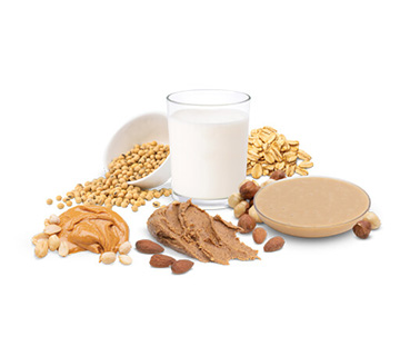 whole nut butter paste with glass of milk